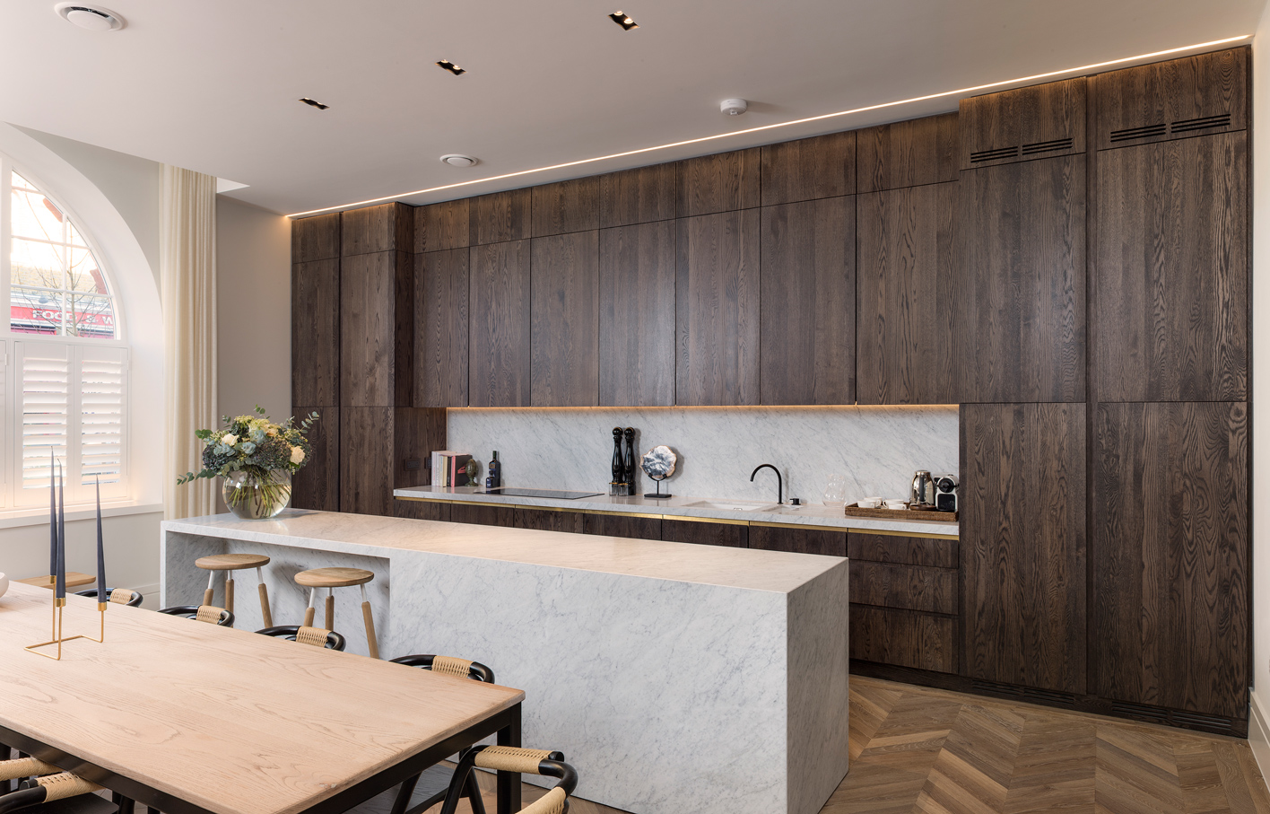 Aldworth James & Bond | Stained oak kitchen featuring brass handle details