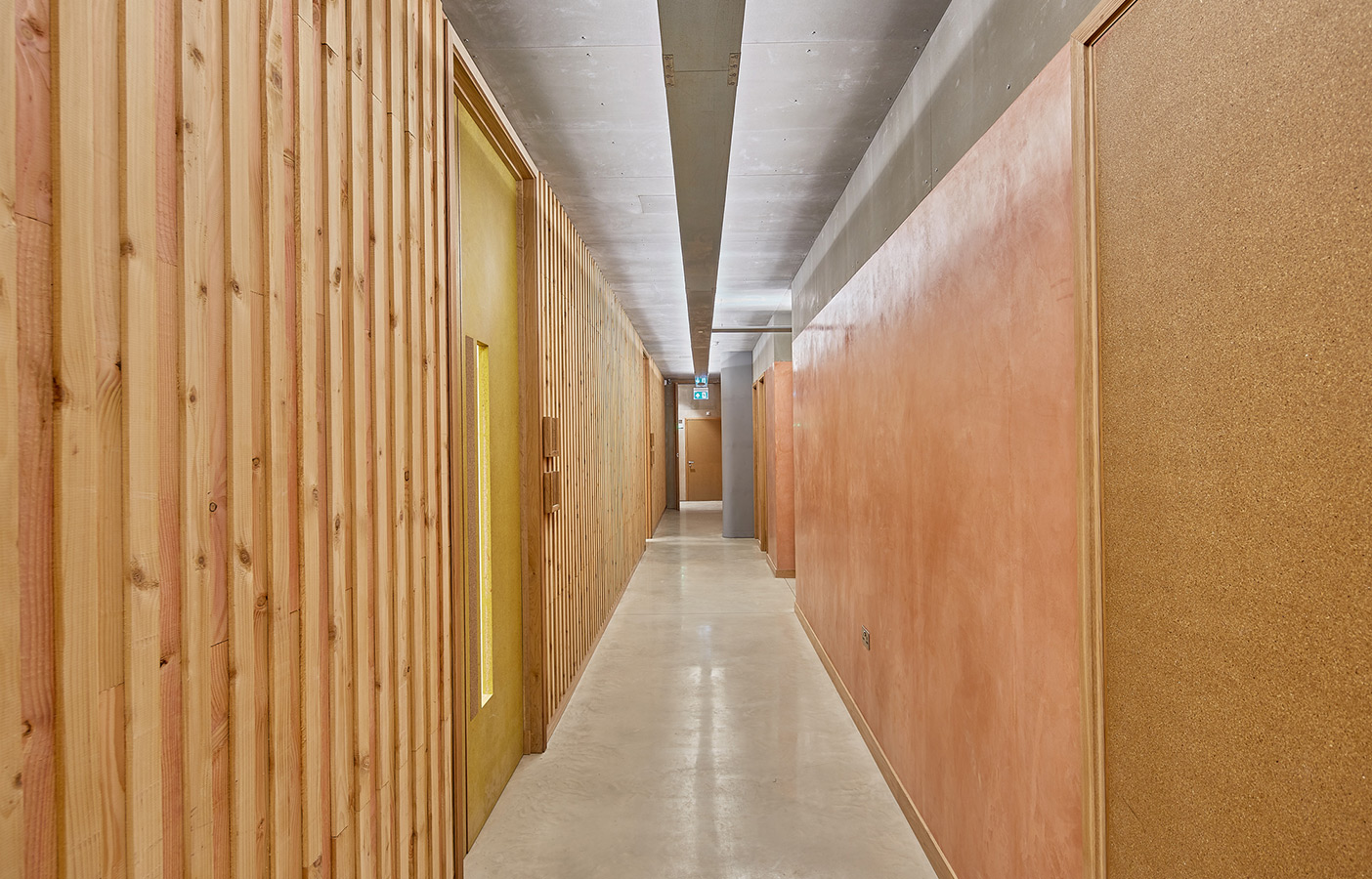 Aldworth James & Bond | triyoga Shoreditch Studio | Hallway with exposed plaster and timber panelling